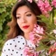 Profile picture of Irene Roberts with flowers as background